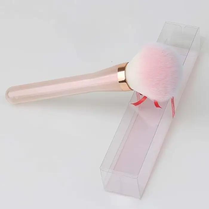 Brosse de maquillage rose irisée