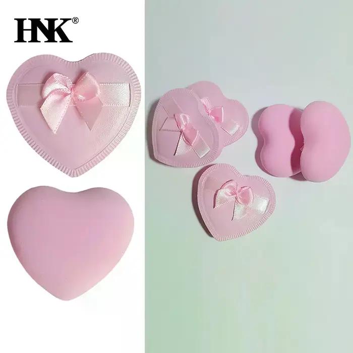 Bouffantes de poudre de maquillage avec nœud en forme de cœur