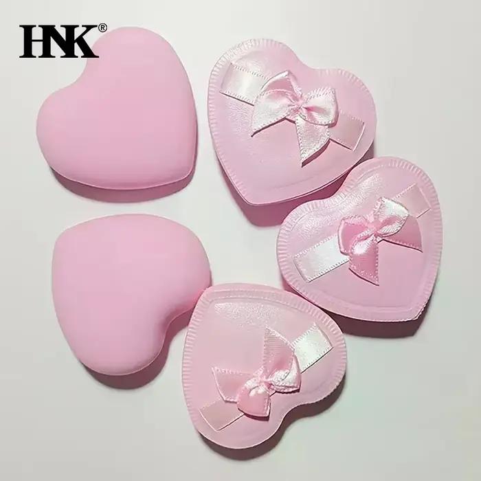 Bouffantes de poudre de maquillage avec nœud en forme de cœur